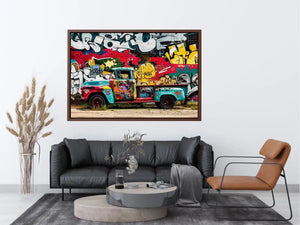 Vintage graffiti pickup truck wall art with colorful urban street mural background.