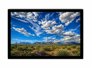 Southwestern desert landscape wall art with dramatic blue sky, mountains, and cactus scenery