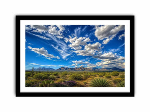 Southwestern desert landscape wall art with dramatic blue sky, mountains, and cactus scenery
