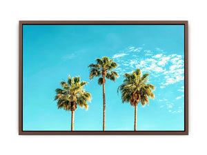 Palm trees against a bright blue sky in tropical landscape artwork