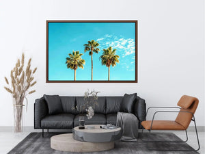 Palm trees against a bright blue sky in tropical landscape artwork