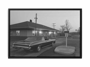 Black and white classic car photo with roadside building for office decor.