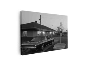 Black and white classic car photo with roadside building for office decor.