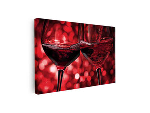 Close up red wine glasses with pouring motion for dining room wall art.