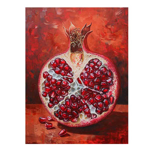 Sliced red pomegranate canvas art with glossy seeds for bold kitchen wall decor.