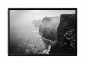Black and white coastal cliff photography print with misty ocean for modern living room decor.