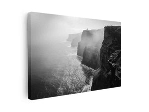 Black and white coastal cliff photography print with misty ocean for modern living room decor.