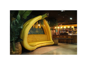 Oversized banana lounge artwork in tropical modern style for living room, home bar, and contemporary interior decor.