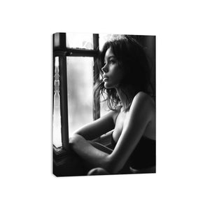 Black and white contemplative woman portrait canvas art with window light for modern bedroom and living room decor.