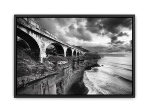 Black and white coastal bridge photography for moody modern office wall decor.