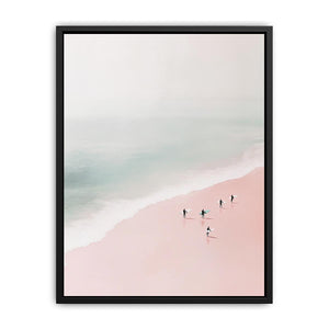 Minimalist coastal photography of surfers on a blush pink beach for modern bedroom decor.