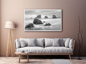 Black and white coastal landscape photography for serene living room decor
