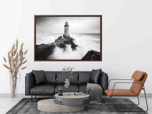 Black and white lighthouse photography wall art with storm waves for modern office decor.