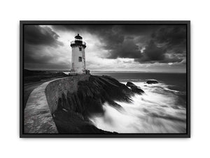 Moody black and white lighthouse wall art with storm clouds for modern living room decor.