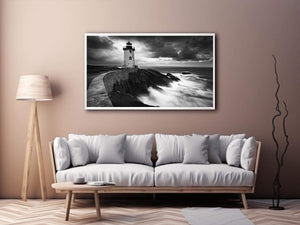 Moody black and white lighthouse wall art with storm clouds for modern living room decor.