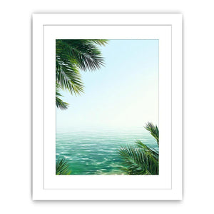 Minimal coastal ocean canvas art with palm leaves for relaxing bedroom decor.