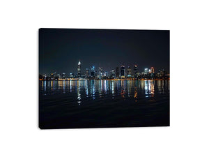 Night city skyline artwork with reflections for modern office decor.