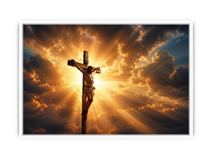 Jesus on the cross illuminated by heavenly golden light with dramatic clouds Christian wall art canvas print
