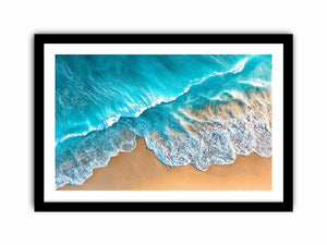 Aerial turquoise ocean beach canvas print with white foamy waves washing over sandy shore and tropical coastal water view