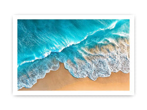 Aerial turquoise ocean beach canvas print with white foamy waves washing over sandy shore and tropical coastal water view