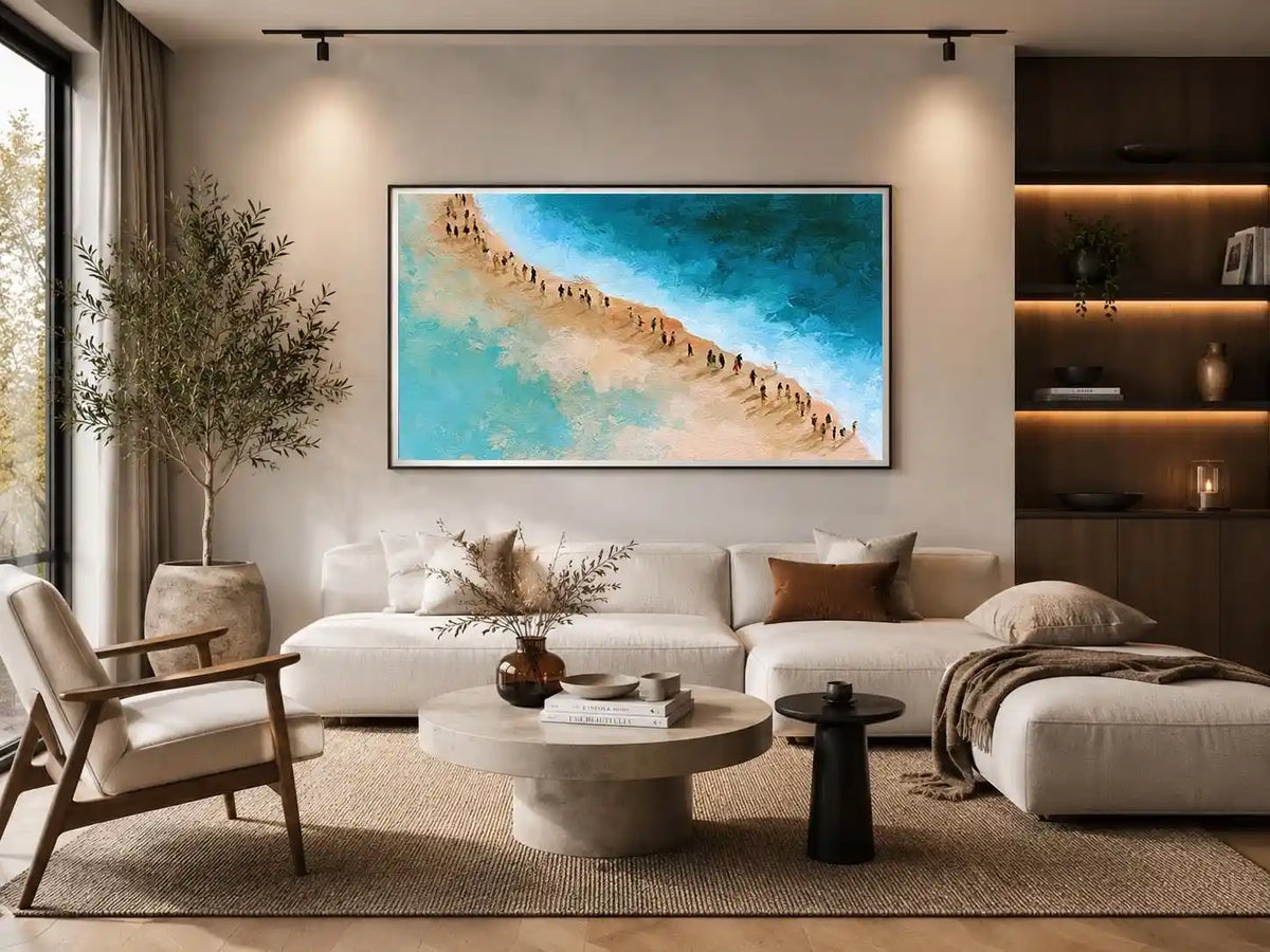 Aerial beach canvas art with turquoise water and walking figures for coastal living room decor.