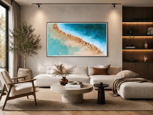 Aerial beach canvas art with turquoise water and walking figures for coastal living room decor.