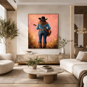 Western cowgirl with guitar canvas art in soft pink tones for bedroom decor.