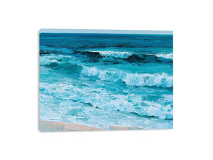 Horizontal turquoise ocean wave canvas art for calming coastal living room decor.