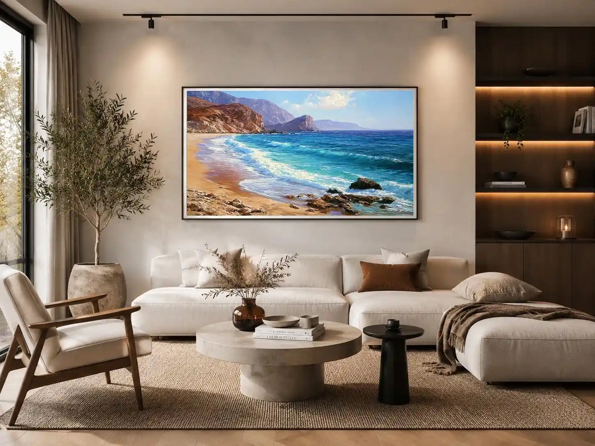 Coastal beach canvas art with blue waves and cliffs for relaxed living room decor.
