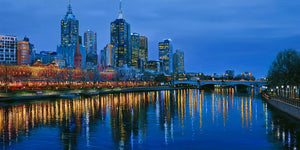 Yarra River night canvas art with Melbourne skyline and glowing reflections for luxury office decor.