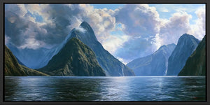 Dramatic fjord mountain canvas with calm water and luminous clouds for serene living room or bedroom decor.