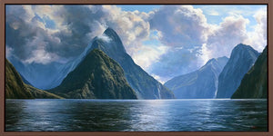 Dramatic fjord mountain canvas with calm water and luminous clouds for serene living room or bedroom decor.