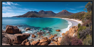 Turquoise coastal bay canvas art with mountains for modern beach house decor.