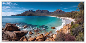 Turquoise coastal bay canvas art with mountains for modern beach house decor.