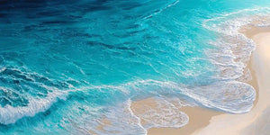 Turquoise aerial ocean canvas art for fresh coastal living room decor.