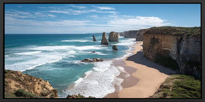 Dramatic coastal cliff canvas art with ocean waves for modern living room decor.