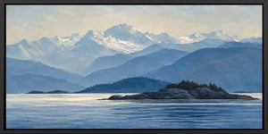 Blue mountain lake canvas art with island, snowy peaks and peaceful water.