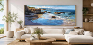 Rocky coastal shoreline canvas art with blue sea, cliffs and sunlit reflections.