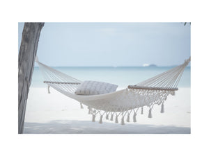 White beach hammock canvas art for calm coastal bedroom decor.