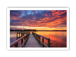 Sunset jetty canvas print with glowing water for modern living room decor.
