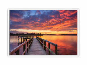 Sunset jetty canvas print with glowing water for modern living room decor.