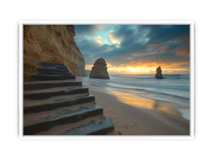 Moody coastal beach photograph with cliffs and stairs for luxury decor.