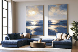 Blue and gold ocean canvas art with sunlit waves for luxury living room decor.