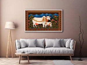 Kamdhenu sacred cow wall art with calf and traditional detailing in gold and red tones for spiritual home decor