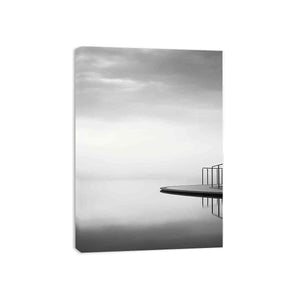 Minimal ocean platform canvas art in soft black and white for modern interiors.