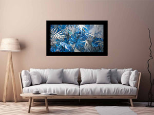 Blue tropical leaf canvas art with silver palm foliage for glamorous modern wall decor.