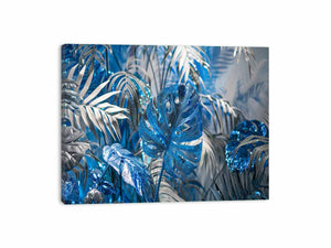 Blue tropical leaf canvas art with silver palm foliage for glamorous modern wall decor.