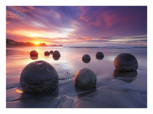 Coastal sunset boulder canvas print for serene beach house or living room decor.