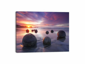 Coastal sunset boulder canvas print for serene beach house or living room decor.