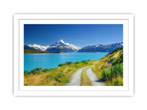 Alpine Lake Path canvas art featuring turquoise alpine lake, path and snow mountains for modern living room decor.